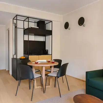 a room with a table and chairs