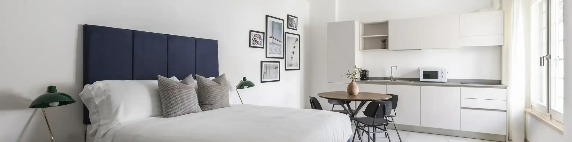 a bedroom with a bed and a table