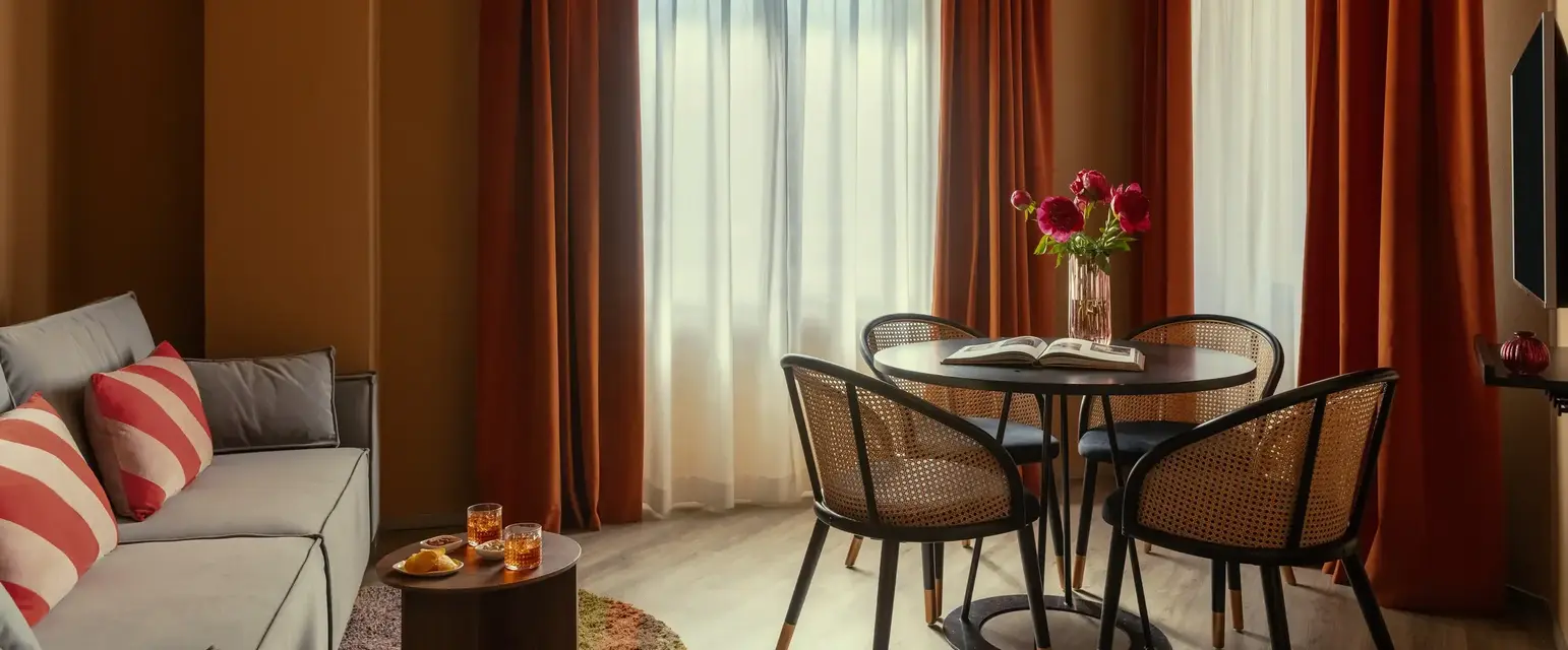 a room with a table and chairs