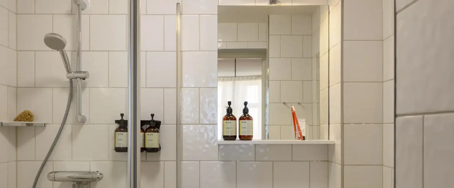 a bathroom with a sink and shower