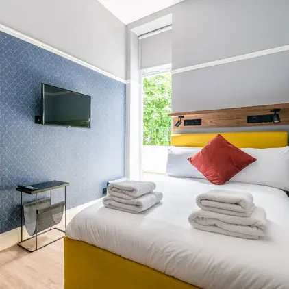 a bed with towels on it