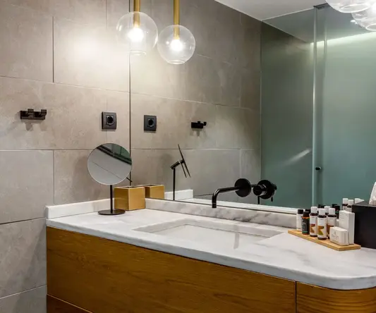 a bathroom with a sink and mirror
