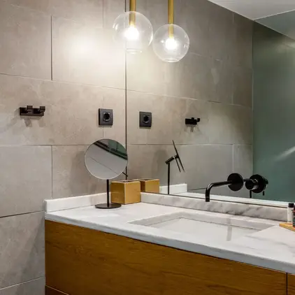 a bathroom with a sink and mirror