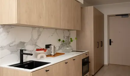 a kitchen with wood cabinets and a sink