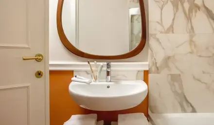 a bathroom with a mirror and sink