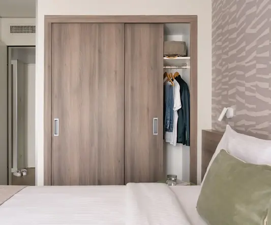 a closet with clothes in it