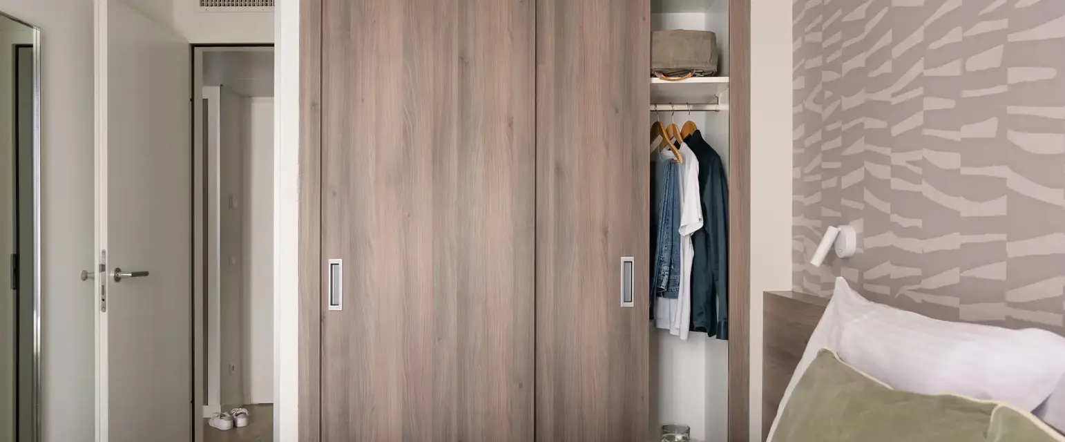 a closet with clothes in it