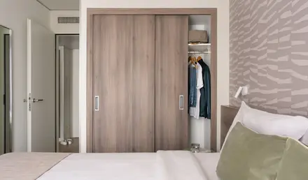 a closet with clothes in it