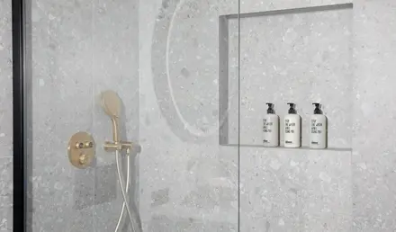 a shower with a shower head and shower head