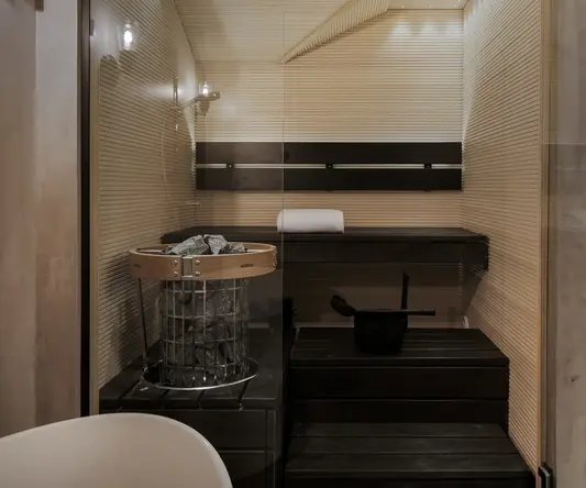 a sauna with a bucket and a bucket