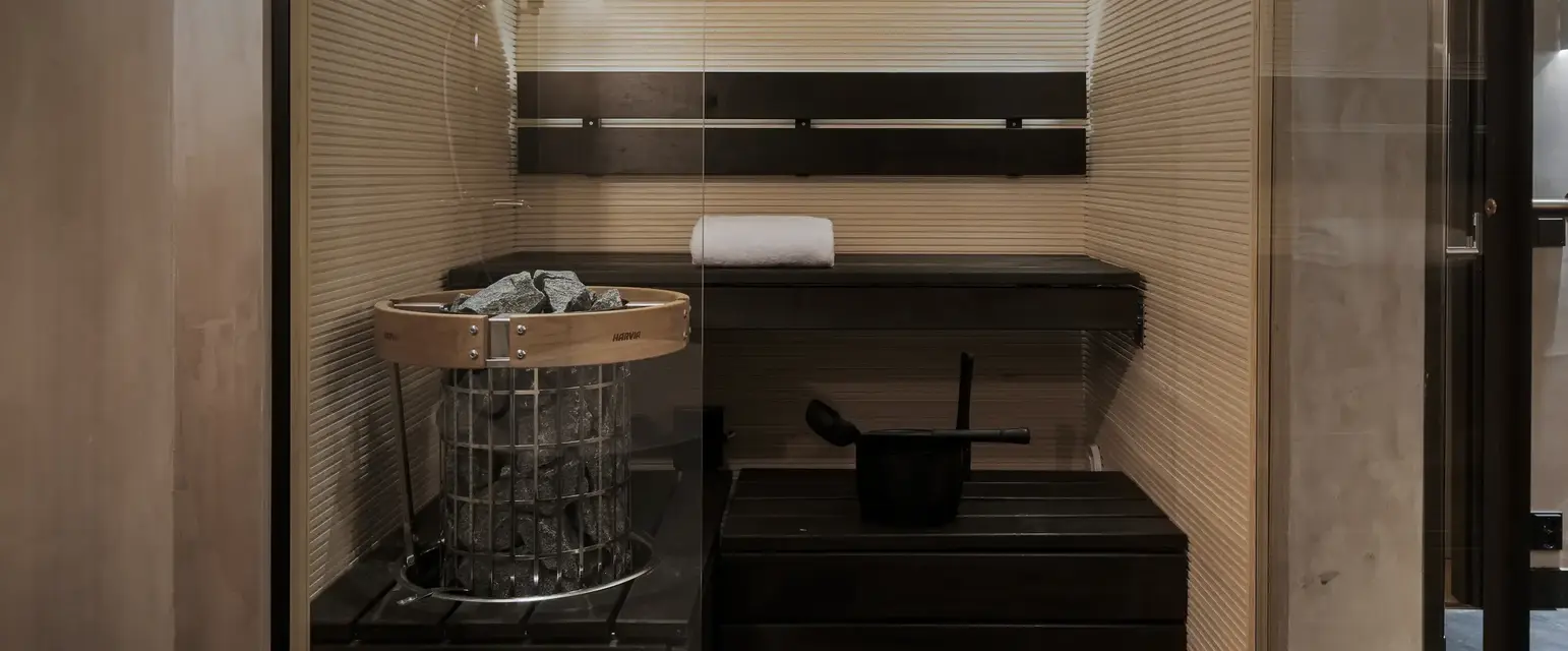 a sauna with a bucket and a bucket