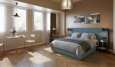 a bedroom with a bed and a desk