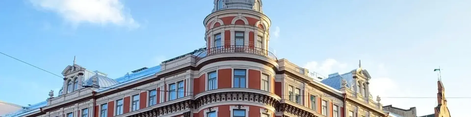 a large building with a tower on the side