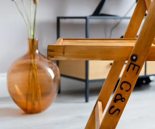 a wooden chair in a room