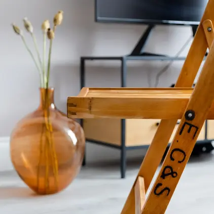 a wooden chair in a room