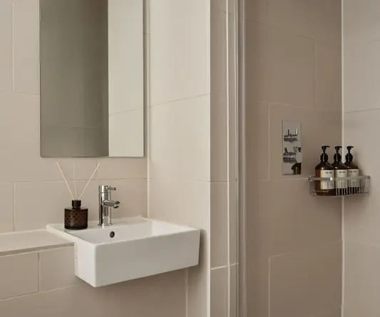 a bathroom with a mirror and sink