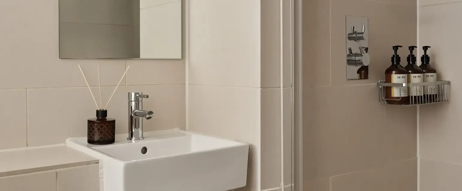 a bathroom with a mirror and sink