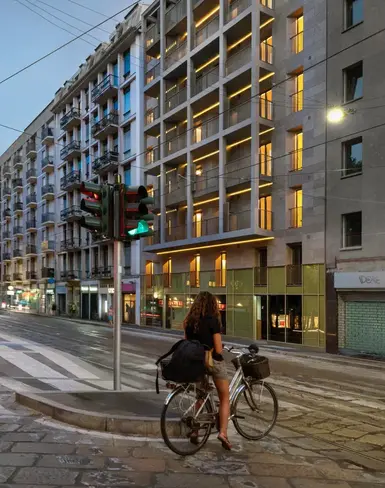a person on a bicycle crossing a street