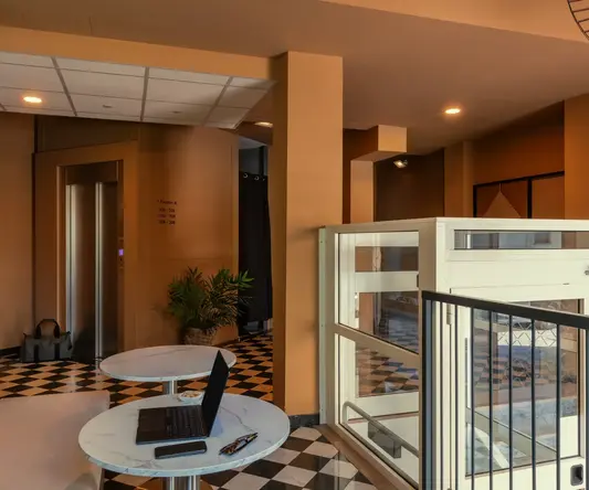 a room with a laptop on a table