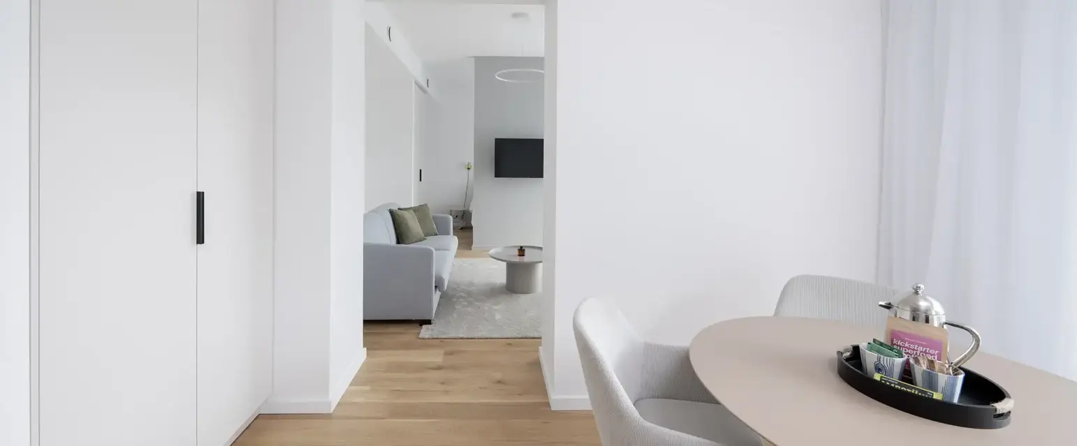 a room with a table and chairs