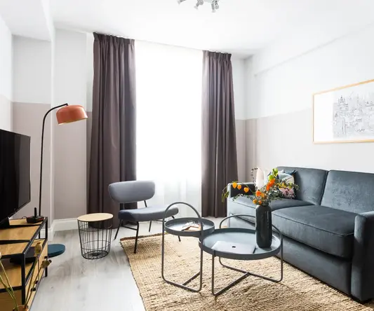 a living room with a couch and a table