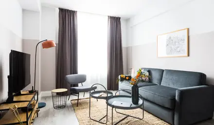 a living room with a couch and a table