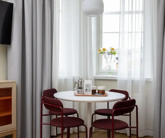 a table with chairs in a room