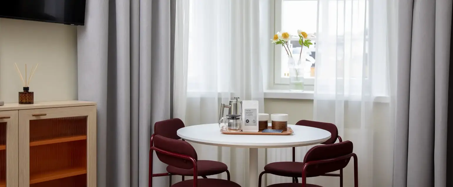 a table with chairs in a room