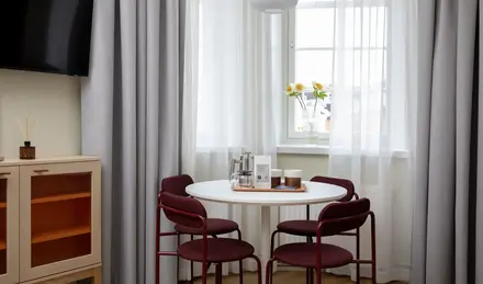 a table with chairs in a room