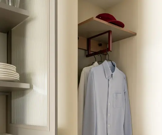 a closet with a shirt and a bag