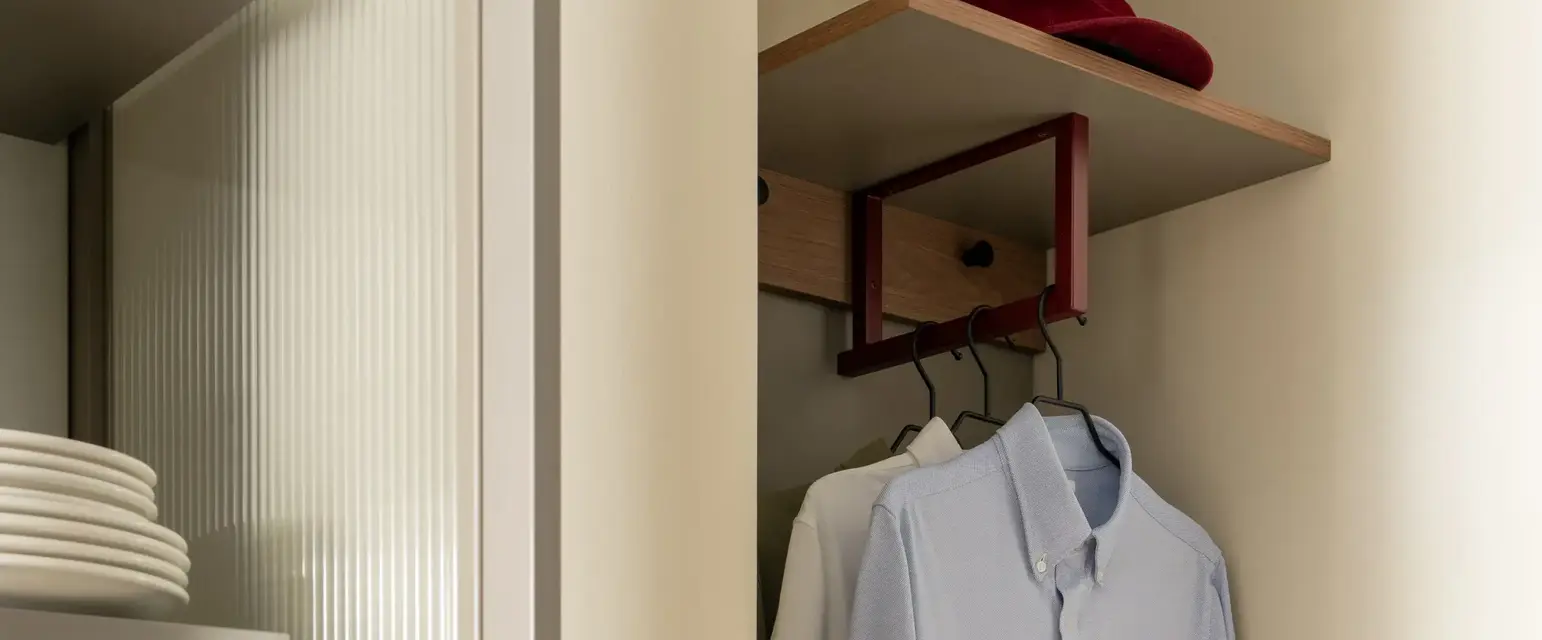 a closet with a shirt and a bag