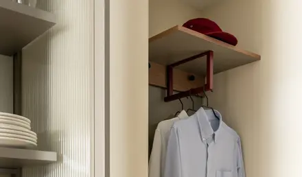a closet with a shirt and a bag