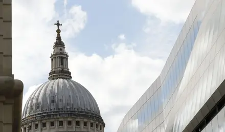 a building with a dome and a cross on top