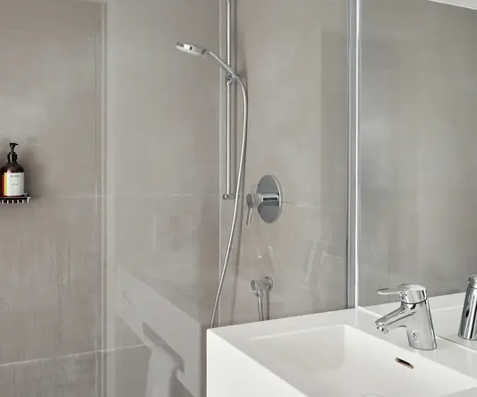 a bathroom with a shower and sink