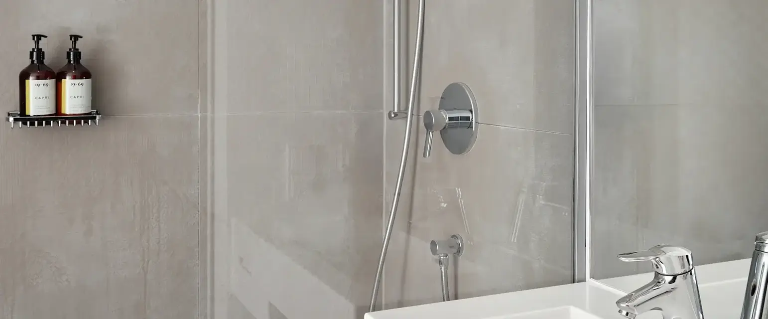 a bathroom with a shower and sink