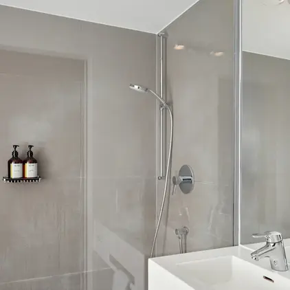 a bathroom with a shower and sink