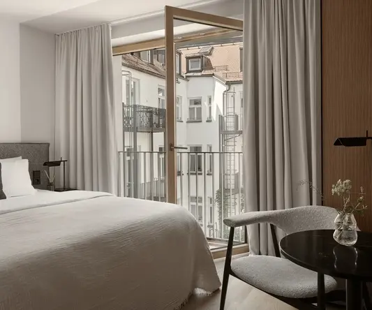 a bedroom with a bed and a chair