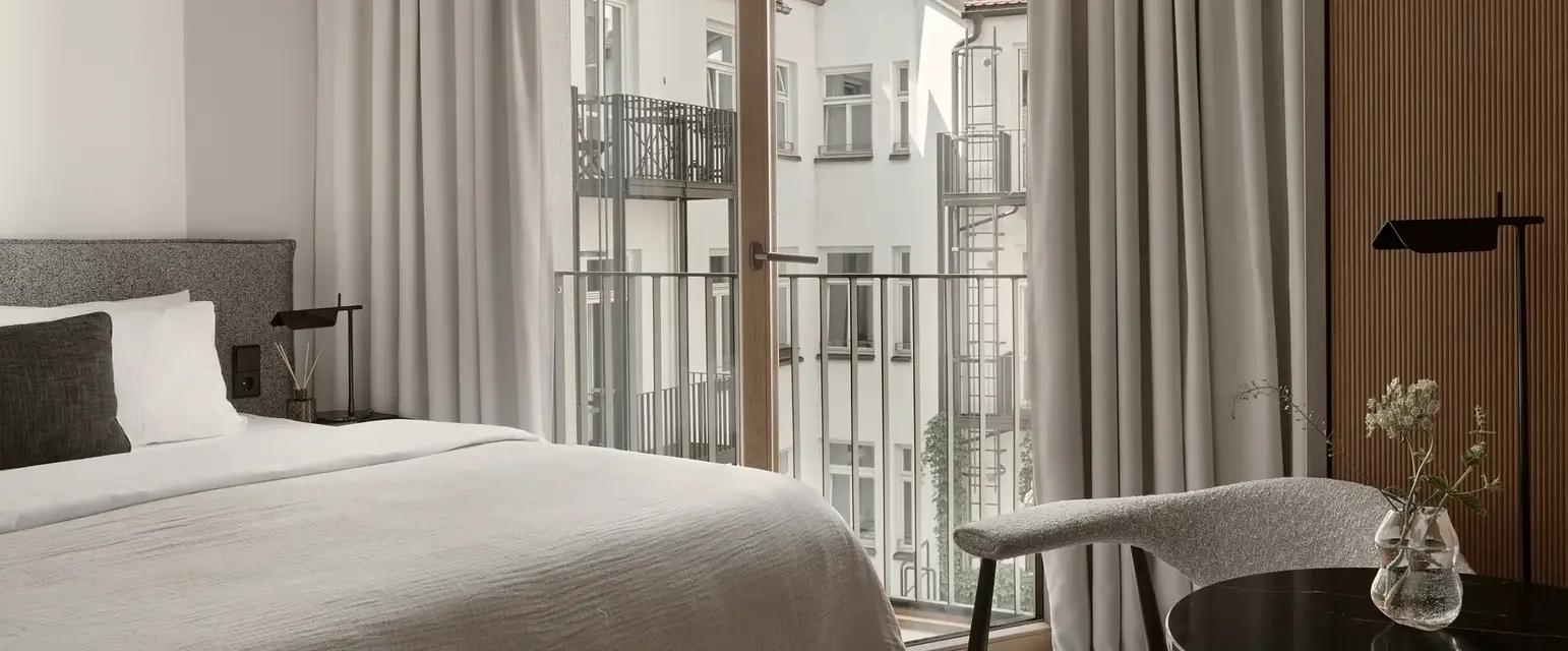 a bedroom with a bed and a chair