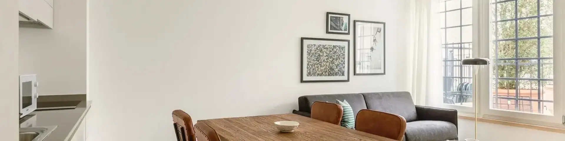 a dining table and chairs in a room