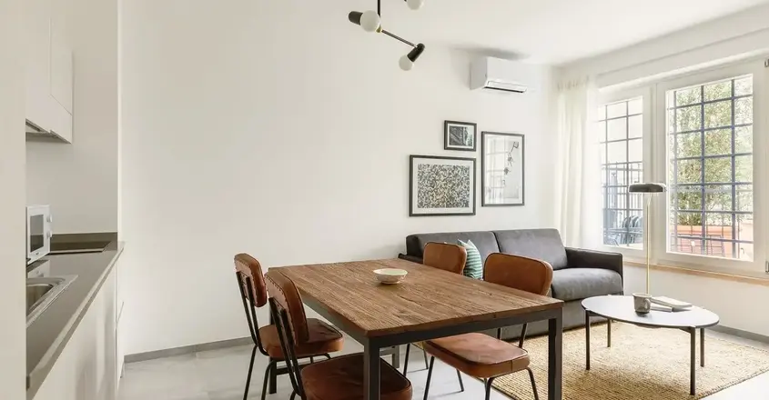 a dining table and chairs in a room