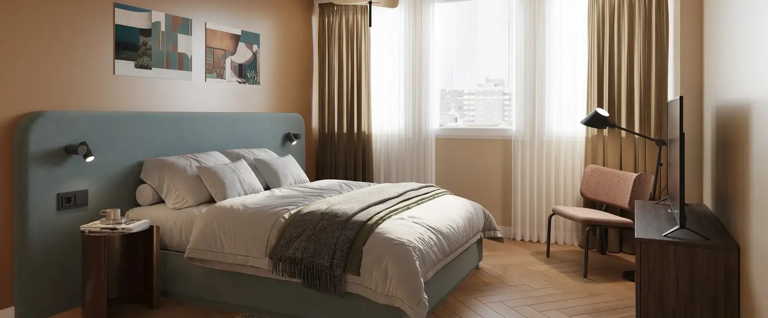 a bedroom with a bed and a desk