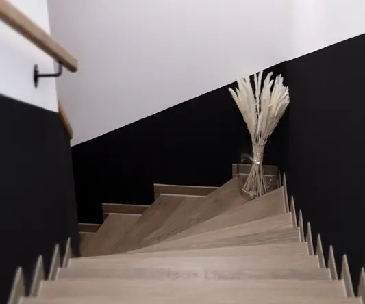 a staircase with a bunch of dried flowers