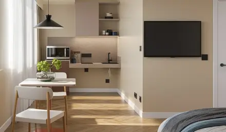 a room with a tv and a bed