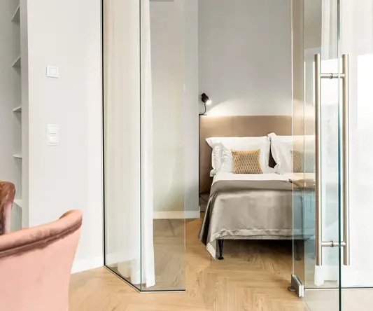a bedroom with glass doors