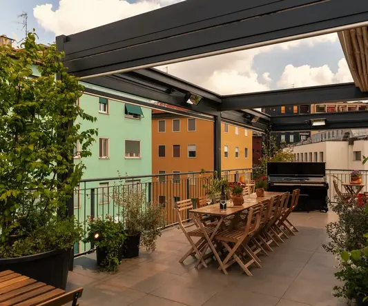 a patio with a table and chairs