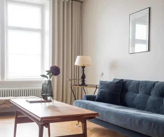 a living room with a couch and a table