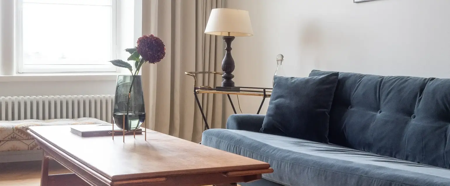 a living room with a couch and a table