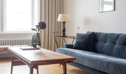 a living room with a couch and a table